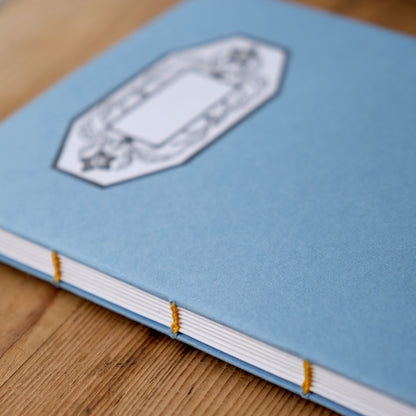 Hand Stitched Softcover Book with Lino Printed Label