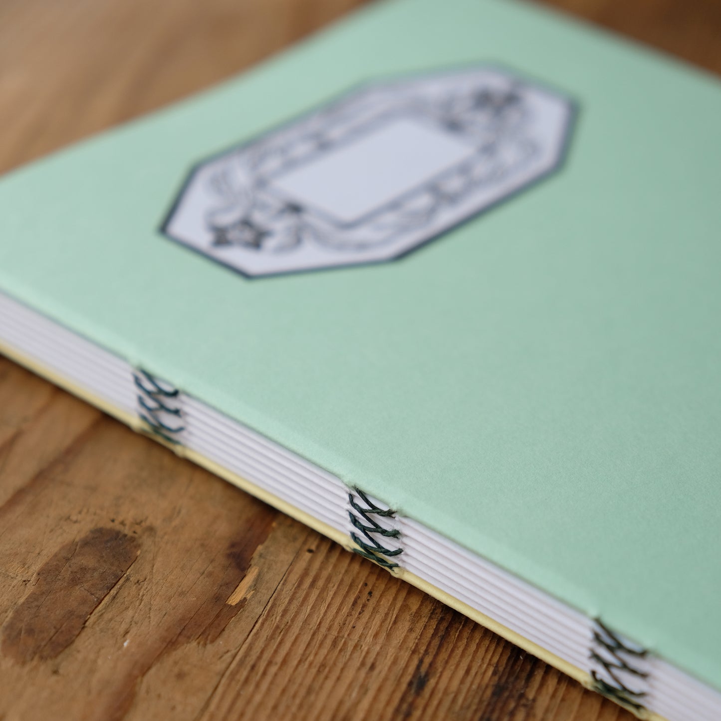 Hand Stitched Softcover Book with Lino Printed Label