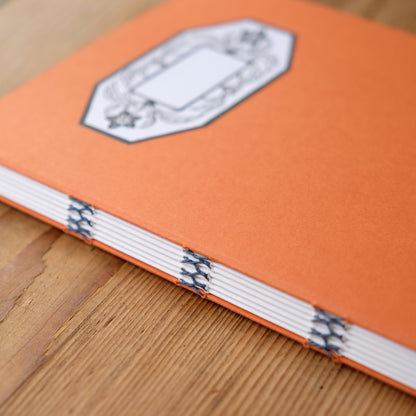 Hand Stitched Softcover Book with Lino Printed Label