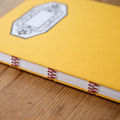 Hand Stitched Softcover Book with Lino Printed Label