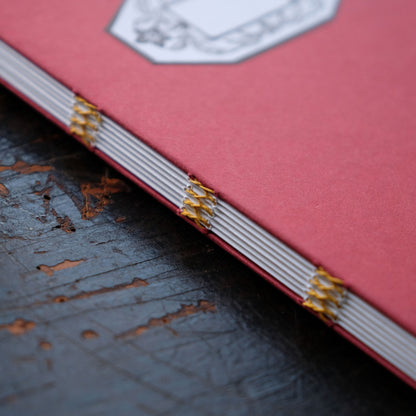 Hand Stitched Softcover Book with Lino Printed Label