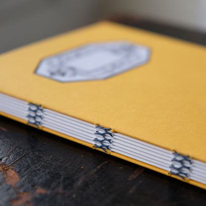 Hand Stitched Softcover Book with Lino Printed Label